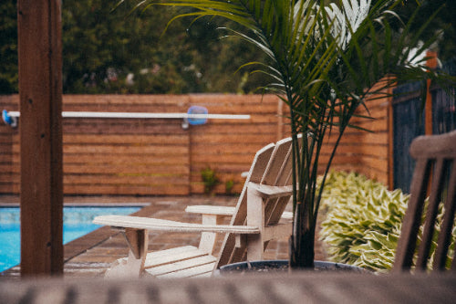poolside-chairs-in-rain stock image